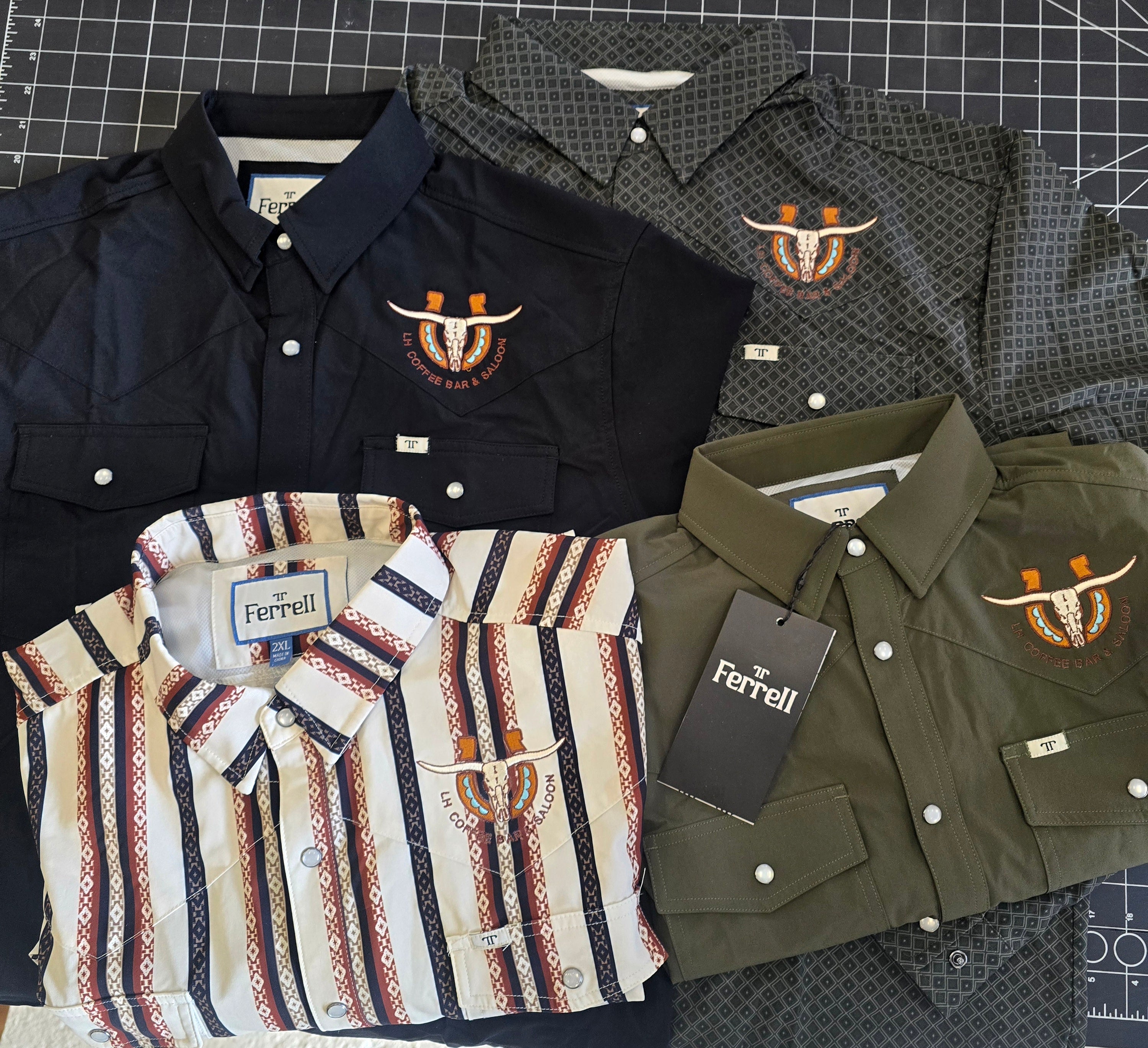 Collection of Ferrell shirts on a checkered background